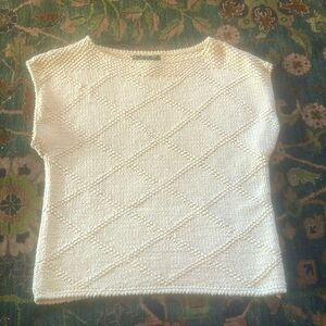 Off white hand knit sleeveless top.